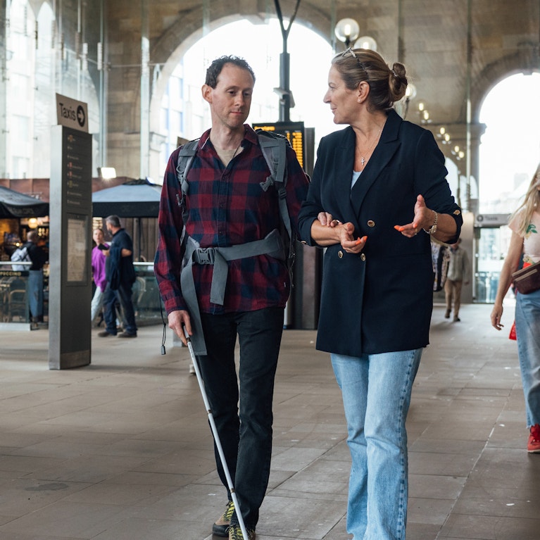 Commuter being assisted in train station