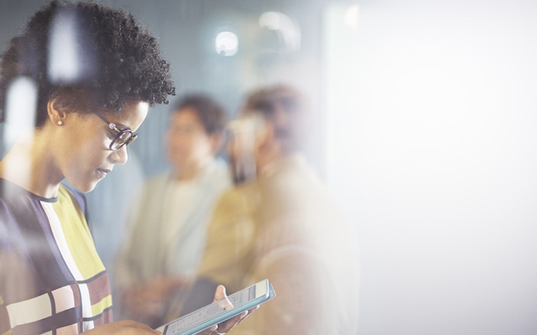 Woman reading tablet device