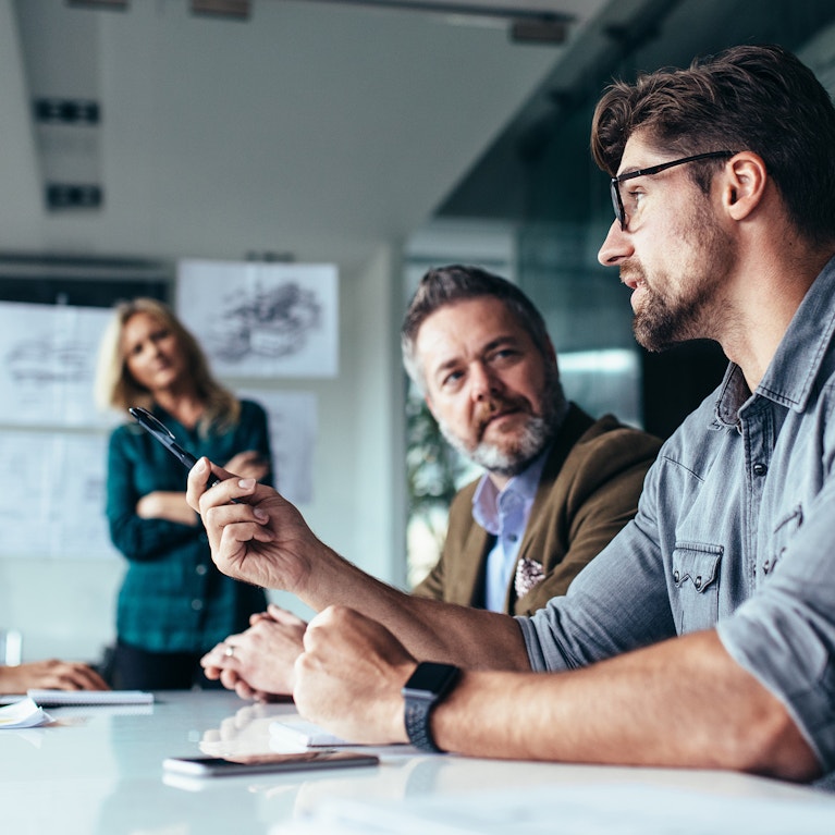 Team of professionals discussing over new business project