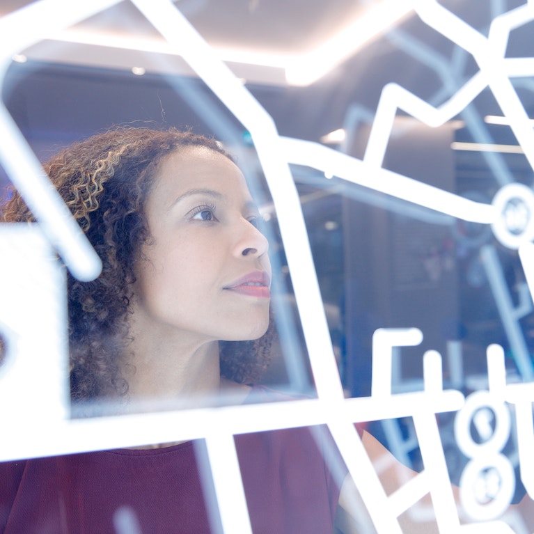 Woman operating digital interface technology