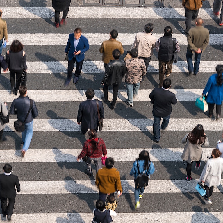 Aerial view of people on busy pedestrian crossing
