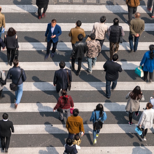 Aerial view of people on busy pedestrian crossing