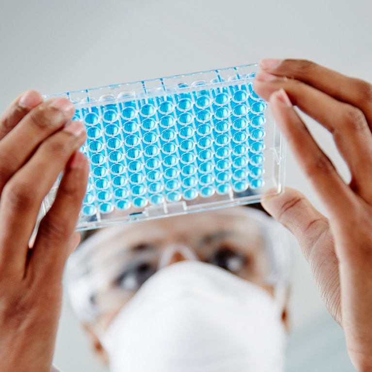 Woman examining laboratory samples