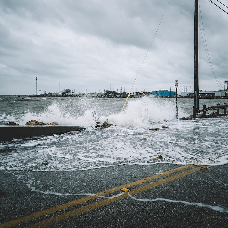 Water crashing over bridge during hurricane
