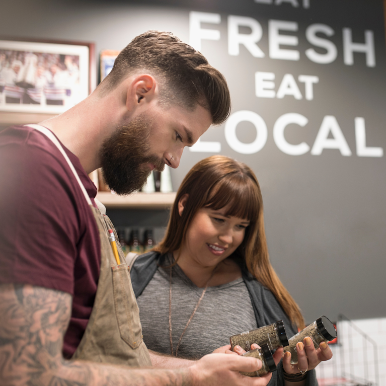 Customer selecting goods in local store