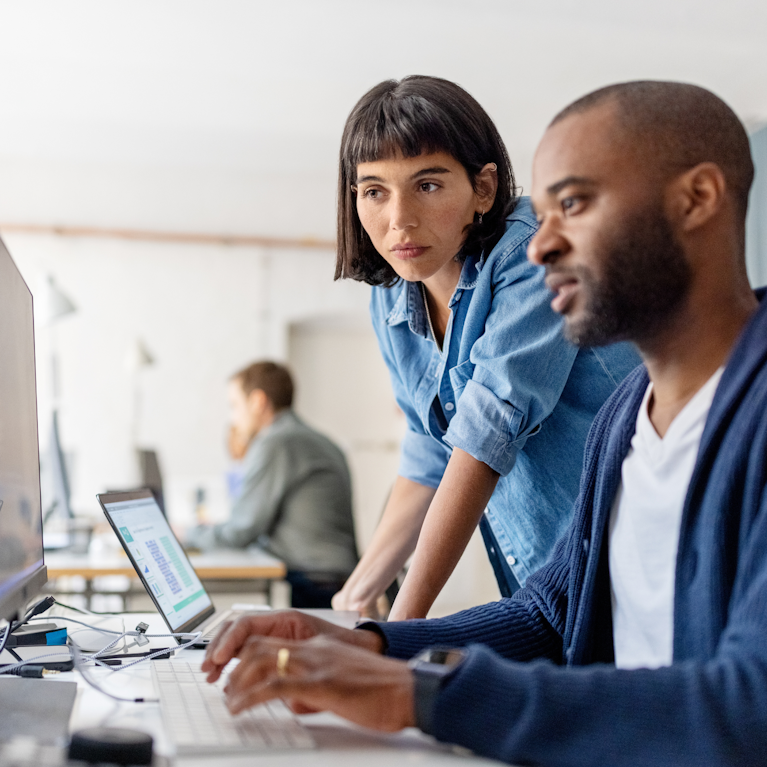 Colleagues working in office
